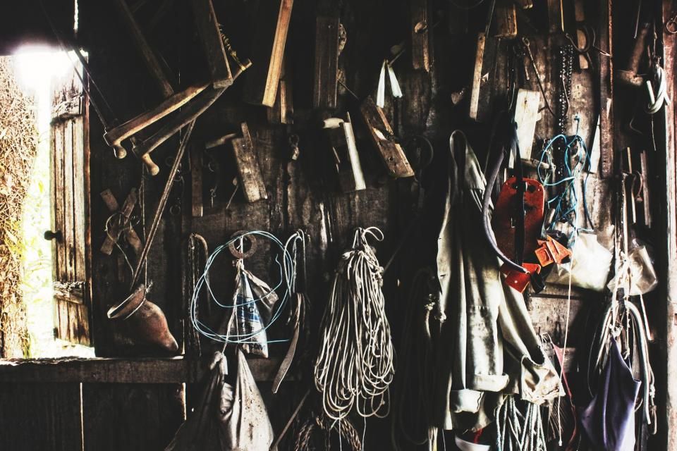A wall of hand tools hanging in a workshop